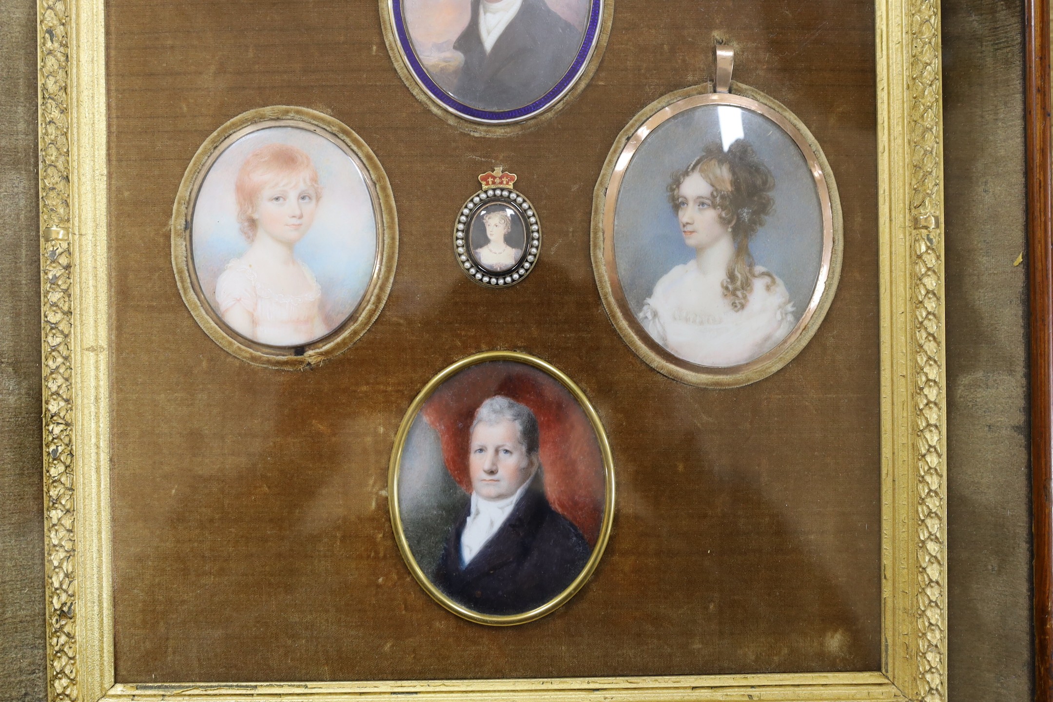 A group of five 19th century portrait miniatures on ivory, framed as one, in a decorative gilt and velvet mount rosewood frame. Overall 36 x 32cm